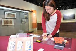Visitors are invited to make their own ukiyo-e postcard print by using rubber stamps provided at the exhibition.