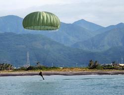 Safely parachuting in difficult terrain requires extensive training. (Courtesy of the Military News Agency.)
