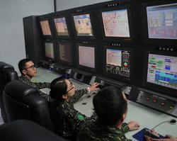Navy personnel learning how to operate a drone. (Courtesy of the Military News Agency.)
