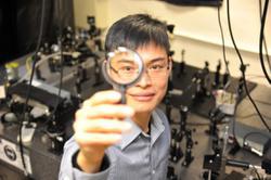 
Prof. Liu holding a sample of the thinnest lens.