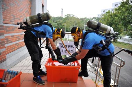 
After removing the contents, some cylinders have to be soaked in water to neutralize any residual toxins. 