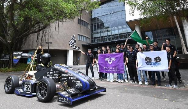 Student club NTHU Racing with the electric race car they developed.