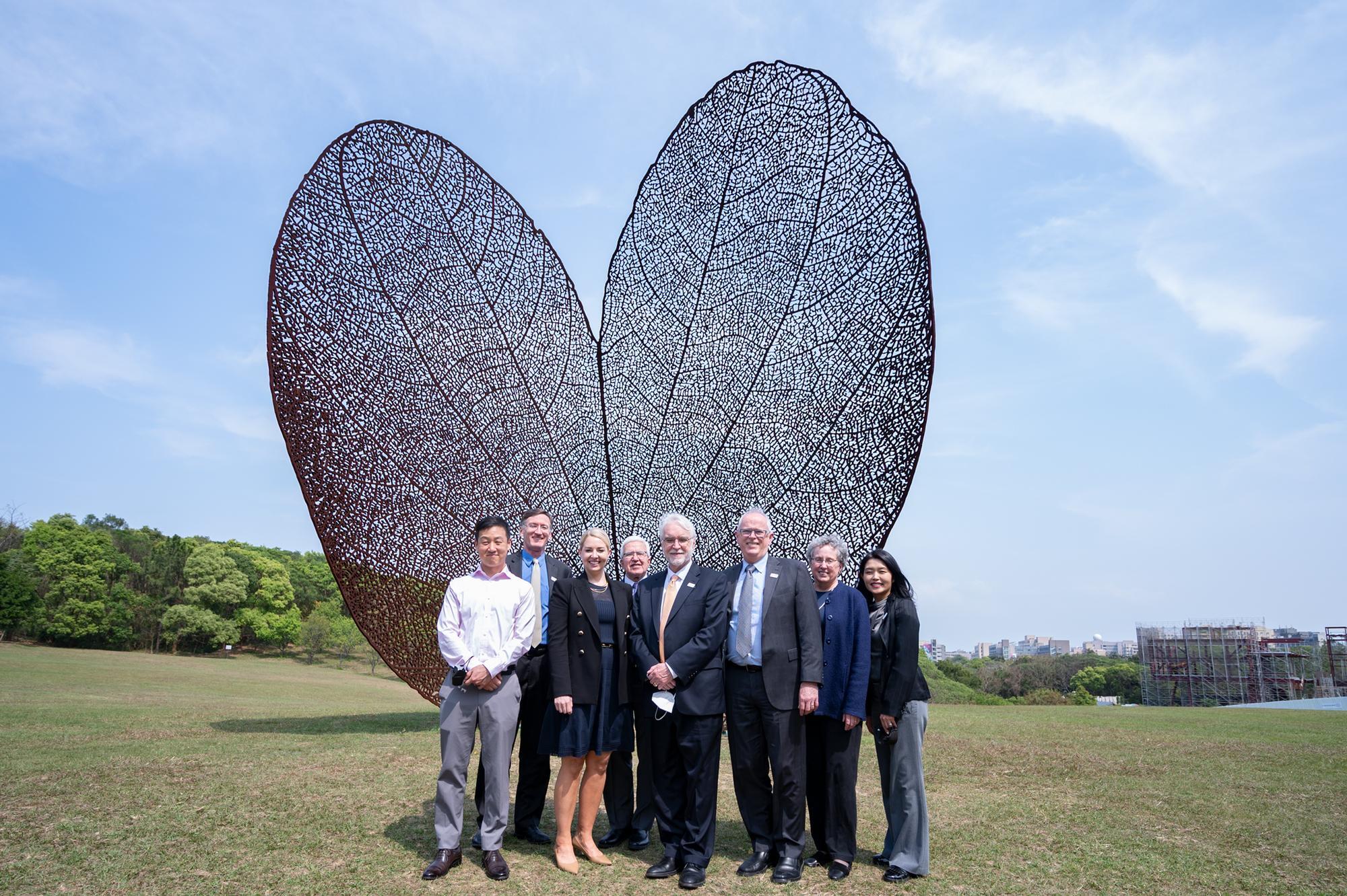 University of Illinois System delegation took photos in front of the well-known public art 