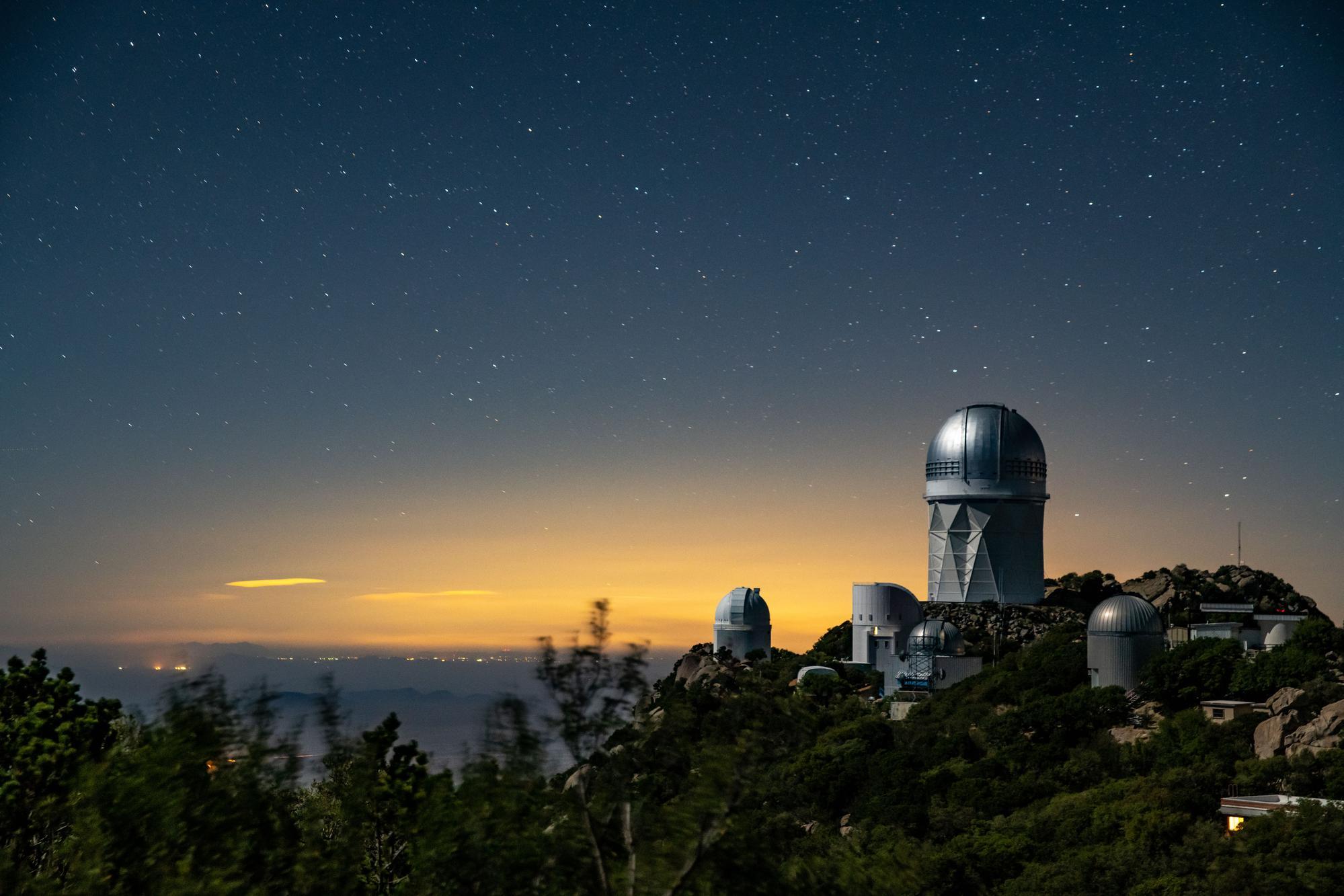 DESI was installed on the Mayall Telescope at Kitt Peak National Observatory near Tucson, Arizona. (top right of the dome) 

Photo courtesy of Marilyn Sargent, LBNL