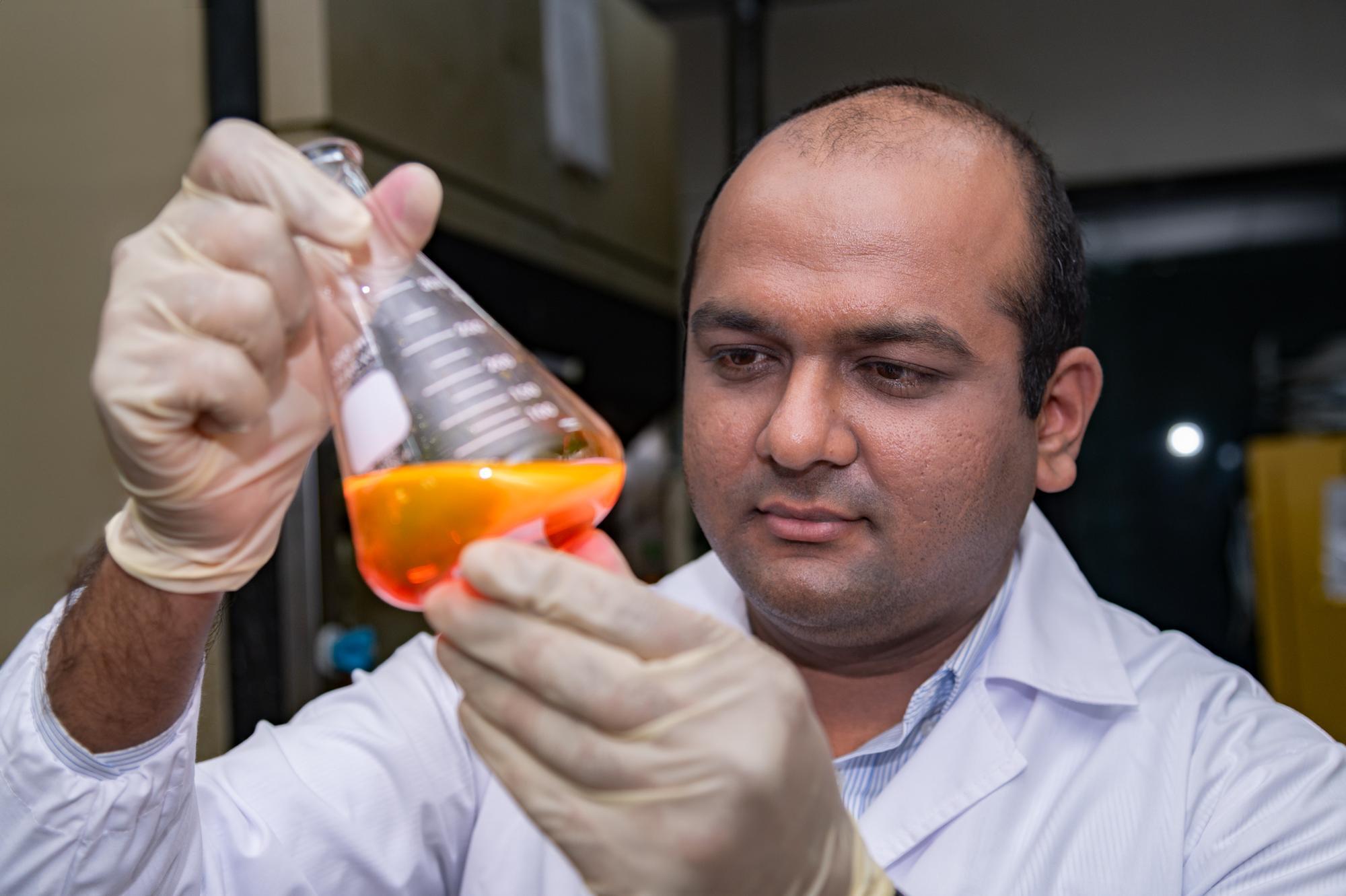 Postdoctoral researcher Vaibhav Pramod Charpe from NTHU examines persistent organic pollutants (POPs) that have been dyed.