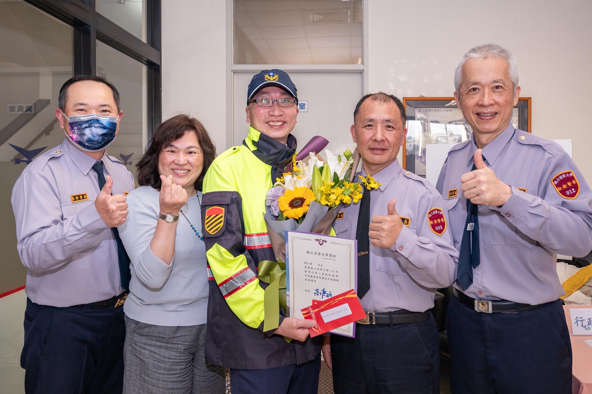 NTHU security personnel cheer for their colleagues for their outstanding performance.