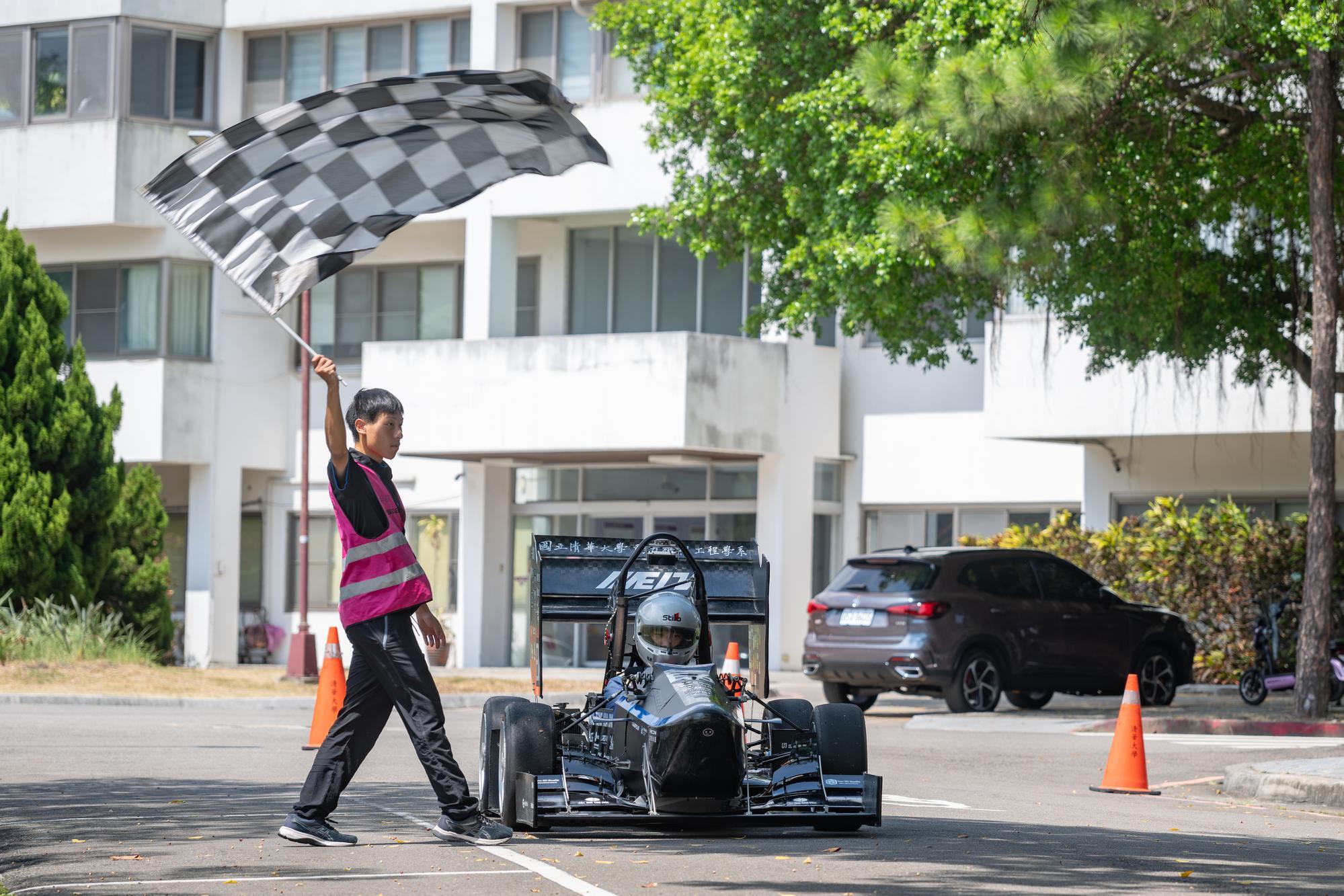 The eighth-generation race car, TH08, is showcased in a dynamic demonstration by the NTHU Racing Team.