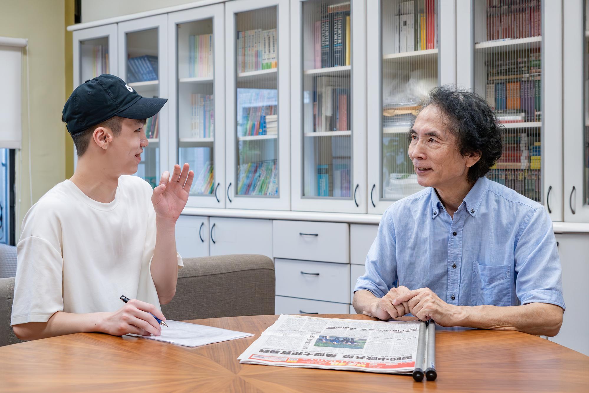 Ogasawara (right) enjoys interacting with his students.
