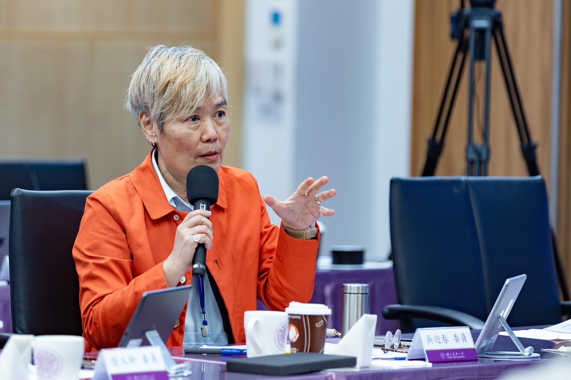 Ying-Chun Wu speaks at the meeting.