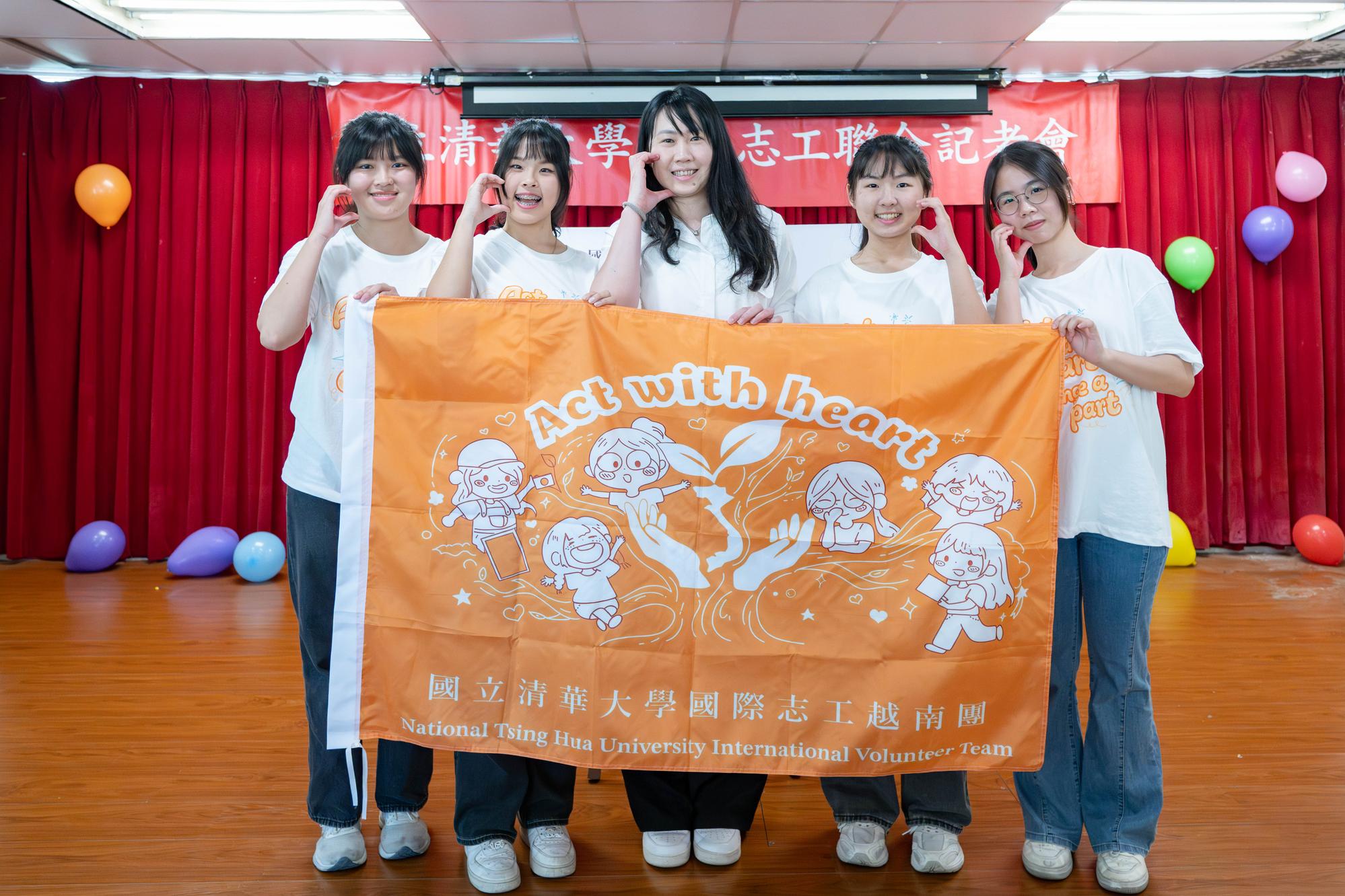 Hui-Fang Szu, Director of the Extracurricular Activities Division (center), poses with the Vietnam volunteer team, which will apply special education expertise to support Agent Orange survivors.
