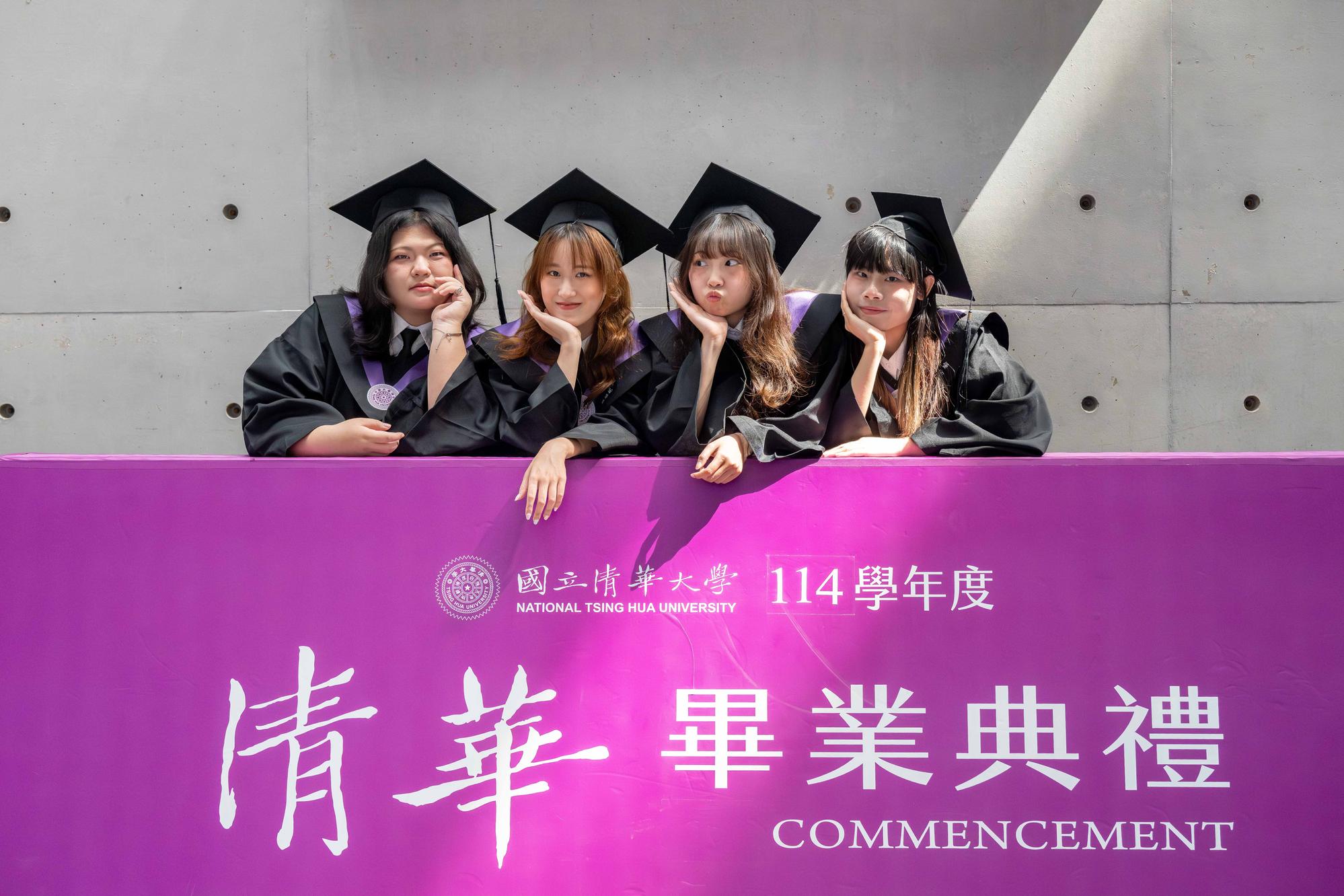 Graduates pose for photos in front of the commencement backdrop, creating lasting memories of their time at NTHU.