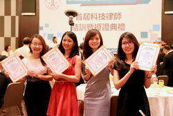 Four participants displaying their certificates.
