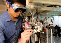 
Ph.D. student Huang Pei-Chi demonstrating how to boost the up-conversion efficiency of HHG.