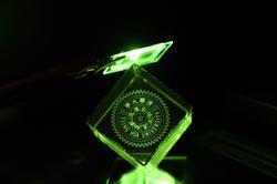 
The green OLED developed at NTHU illuminating the school emblem.