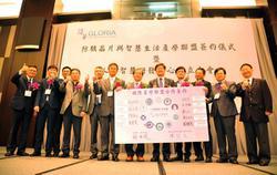 
GLORIA members displaying a poster with their signatures.