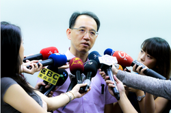 Professor Chiao holding a press conference.