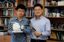 Prof. James Chang (right) and Mr. Shu-Wei Pu are key members of an interdisciplinary research team that has developed a wearable robotic hand for providing robot-assisted rehabilitation for stroke patients.