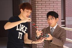 The groundbreaking discovery of a molecular switch by Associate Prof. Masaki Horie (right) and doctoral student Kaj-Jen Chen (left) has recently been published in Nature Communications.