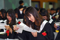 Graduates at the Nanda Campus reading the letters they had written to themselves four years earlier expressing their hopes and expectations for the future.