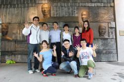
Former members of NTHU’s International Volunteer Society, along with director of extracurricular activities Professor Michael Lu (back row, first from left,) and Professor Wang Jyun-cheng (back row, third from left), who helped establish the Society.