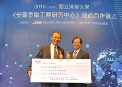 	Senior Vice President Chen (right) and Yang holding a replica of the donation check.